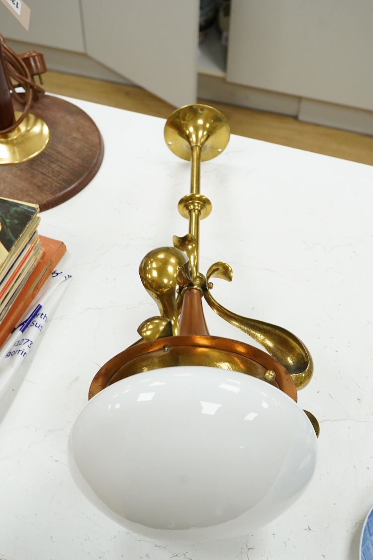 A WAS Benson style Arts & Crafts ceiling light with copper and brass stem and opaque glass shade, 53cm in length